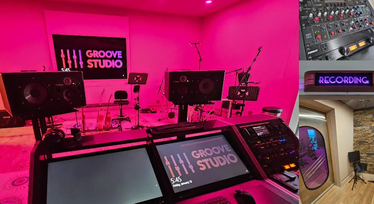 Groove Studio control room with illuminated mixing desk and studio monitors