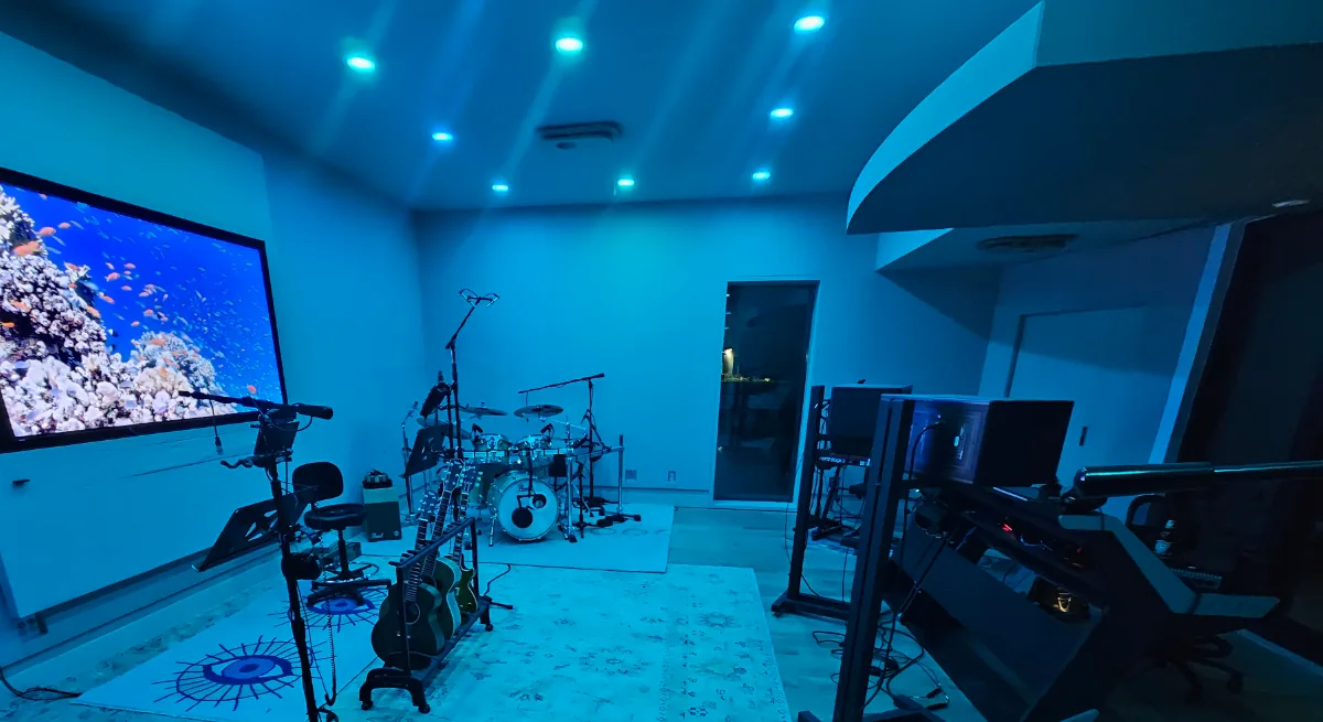 Blue-lit live room at Groove Studio